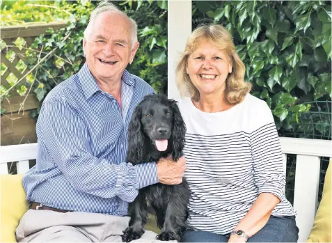  ??  ?? Family first: Johnny Ball with wife Di and the couple’s spaniel, Holly, at their Buckingham­shire home