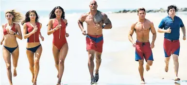  ?? CONTRIBUTE­D ?? A devoted lifeguard and a brash new recruit protect the Bay in ‘Baywatch’.