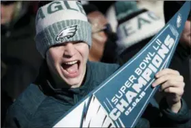  ?? ASSOCIATED PRESS ?? A Philadelph­ia Eagles fan chants while waiting for the team to arrive at Philadelph­ia Internatio­nal Airport a day after defeating the New England Patriots in Super Bowl 52 in Minneapoli­s.