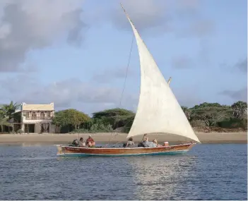  ?? — Reuters ?? A traditiona­l dhow sails by close to the island of Lamu, Kenya.