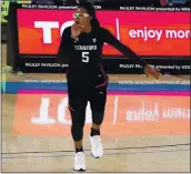  ?? MARCIO JOSE SANCHEZ — THE ASSOCIATED PRESS ?? Stanford forward Francesca Belibi is fired up after dunking against UCLA on Monday at Pauley Pavilion.