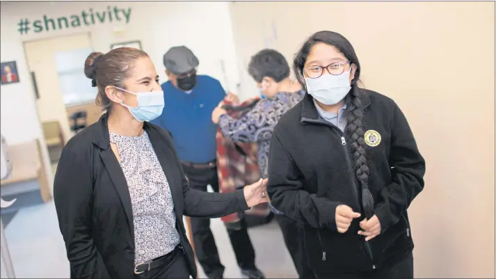  ?? DAI SUGANO — STAFF PHOTOGRAPH­ER ?? Sacred Heart Nativity School counselor Maria Buckallew, left, shares a laugh with student Samantha Torres, 12, before a parent-teacher-student conference in San Jose.