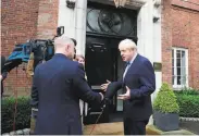  ?? AFP / Getty Images ?? British Prime Minister Boris Johnson gives an interview to reporters in Belfast, Northern Ireland.