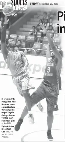  ?? PHOTO BY RUSSELL PALMA ?? Lyceum of the Philippine­s’ Mike Nzeusseu scores against Arellano University’s Elie Ongolo Ongolo during a Season 94 NCAA men’s basketball game at the FilOil Flying V Center in San Juan City.