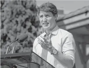  ?? ANDREJ IVANOV REUTERS ?? Prime Minister Justin Trudeau speaks about the ethics commission­er’s report that said he breached ethics rules in the SNC-Lavalin affair, at the Niagara-on-the Lake Community Centre in Niagara-on-the-Lake, Ont., on Aug. 14. •