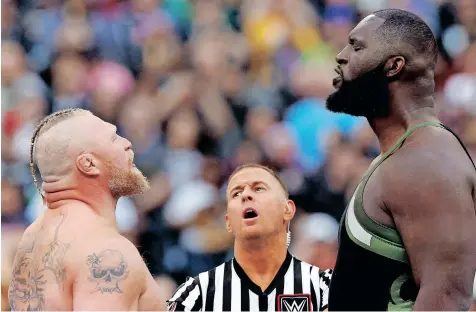  ?? ?? BROCK Lesnar, left and Omos face off during drafts. AFP
at SoFi Stadium in California last month. Lesnar and Omos are now free agents after not making the
or