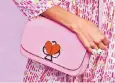  ??  ?? Motif: Kate Spade’s Nicola shoulder bag features a distinctiv­e spade clasp