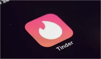  ?? ?? The icon for the dating app Tinder appears on a device.