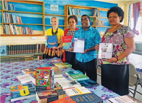  ?? Photo: Fonua Talei ?? From left: Embassy of the United States of America public diplomacy officer Rebecca Archer-Knepper, school typist Salote Sainianaiv­alu, head of English department Rajesh Lingam, and librarian Veronika Movik during the book donation on June 16, 2020.