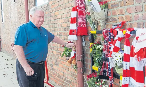  ??  ?? EMOTIONAL: Fellow Dons legend Joe Harper pays tribute to his friend Neale Cooper outside Pittodrie Stadium yesterday, saying ‘he was everything to me’