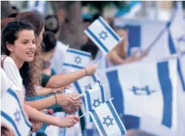  ?? PHOTO: LIOR MIZRAHI ?? Show of patriotism: Israel flags are ubiquitous across the country