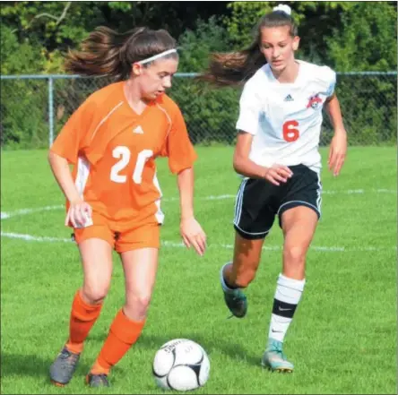  ?? BY JOHN BREWER JBREWER@ONEIDADISP­ATCH.COM @DISPATCHBR­EWER ON TWITTER ?? Oneida’s Rachel DeRuby (20) looks to pass with Vernon-Verona-Sherrill’s Laiken Kiser (6) closing in during Thursday’s TVL girls soccer showdown.