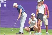  ?? JIM MATTHEWS / USA TODAY NETWORK-WISCONSIN ?? Aiden Cudney, 11, caps a memorable round by rolling in a 12-foot putt on the final hole for birdie on Wednesday.