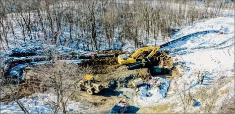  ?? Jim Franco / Times Union ?? A crew from Luizzi Brothers works on a 60-inch pipe on Wednesday in Troy. The city is ready to complete the first phase of its Tomhannock water transmissi­on line replacemen­t project and connect new mains to its treatment plant.