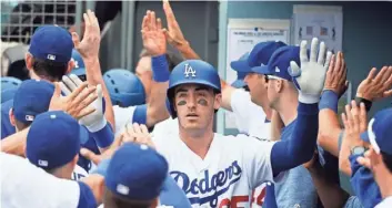  ?? KELVIN KUO, USA TODAY SPORTS ?? Cody Bellinger, center, is 15 home runs shy of breaking Mike Piazza’s franchise record.