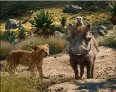  ??  ?? This file image released by Disney shows (from left) young Simba, voiced by JD McCrary, Timon, voiced by Billy Eichner, and Pumbaa, voiced by Seth Rogen, in a scene from “The Lion King.” DISnEY VIA AP