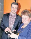  ?? 300317spor­tsaward_10 ?? Young volunteer of the year Connor Flannigan received his award from Provost Eileen Logan