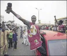  ?? BEN CURTIS / AP ?? Supporters of opposition candidate Muhammadu Buhari celebrate Tuesday in Kano as Buhari, a former dictator, defeated incumbent Goodluck Jonathan.
