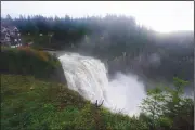 ?? (AP/Ted S. Warren) ?? Water rushes over Snoqualmie Falls on Friday in Snoqualmie, Wash.