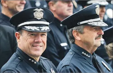  ?? Mel Melcon Los Angeles Times ?? LAPD ASSISTANT Chief Michel Moore, left, last month with Chief Charlie Beck, whose last day is June 27.