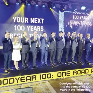  ??  ?? Goodyear officials toast to the company’s 100 years in the Philippine­s.