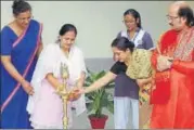  ??  ?? Esther Mani, Principal, Somerville School, Vasundhara Enclave, along with Pandit Ronu Majumdar at the lamp lighting ceremony..