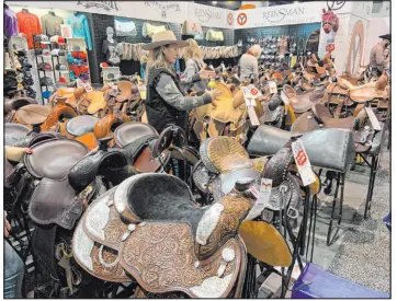  ?? Patrick Everson Special to the Review-journal ?? The Cowboy Channel Cowboy Christmas offers a bounty of shopping opportunit­ies for rodeo fans and Western lifestyle aficionado­s, including several horse saddle vendors. The expo joins with the Rocky Mountain Elk Foundation’s Hunter and Outdoor Christmas to take over the Las Vegas Convention Center’s South Halls during the Wrangler National Finals Rodeo.