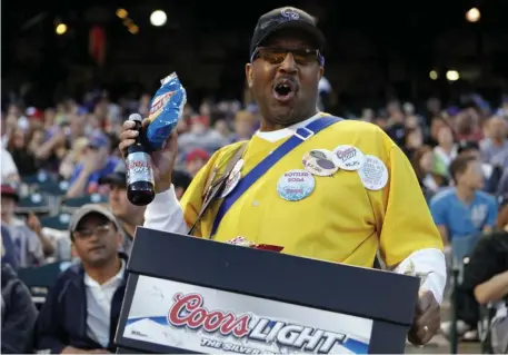  ?? ED anDRIeSkI / aP ?? HEY, BEER MAN!: Passing cash down the row to pay a vendor could become a thing of the past when stadiums around the country reopen.