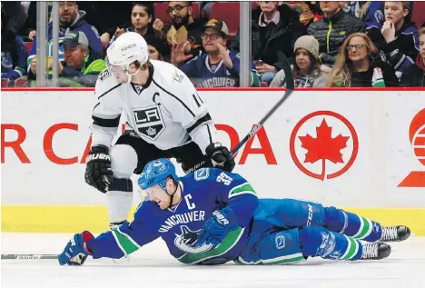  ?? JEFF VINNICK/NHLI VIA GETTY IMAGES/FILES ?? Canucks captain Henrik Sedin will be playing against Los Angeles Kings forward Anze Kopitar on unfamiliar ice when the teams face off in two pre-season games in Shanghai and Beijing this week as part of a league plan to grow the game in China.