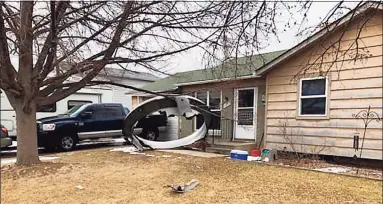  ?? Broomfield Police Department / TNS ?? A courtesy photo from the Broomfield Police Department shows aircraft debris in the front yard of a Broomfield, Colo., home.