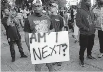  ?? Getty Images ?? In 2016, Charlotte, N.C., residents protest the death of Keith Lamont Scott, shot by a police officer. Both were black.