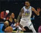  ?? CHRIS O’MEARA — AP ?? Toronto Raptors guard Gary Trent Jr., left, who scored 24 points, drives against the Warriors’ Mychal Mulder.