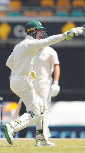  ??  ?? Tim Paine successful­ly appeals for a stumping during his tidy display.