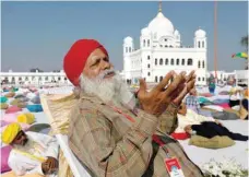  ?? — Reuters ?? A Sikh pilgrim visits the Gurdwara Darbar Sahib in Kartarpur.