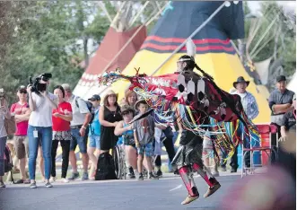  ?? KERIANNE SPROULE ?? The fancy dance is performed during the opening of the Indian Village Friday. Teepee owners feel the Indian Village name symbolizes the long relationsh­ip between the First Nations and the Stampede.