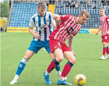  ?? ?? Killie midfielder Liam Polworth tussles with Raith’s Brad Spence