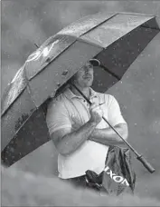  ?? Abbie Parr Associated Press ?? BROOKS KOEPKA thrived throughout difficult and rainy conditions to seize the lead after 54 holes.