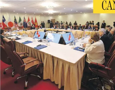  ?? MICK TSIKAS / AAP IMAGE VIA AP / THE CANADIAN PRESS ?? Prime Minister Justin Trudeau’s empty seat is seen at a TPP meeting in Vietnam. No one doubts he had reasons for refusing to sign onto the deal, but none of the motives that have been floated seem creditable, writes Andrew Coyne.