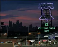  ?? MATT SLOCUM - THE ASSOCIATED PRESS ?? In this Aug. 6, 2020file photo, the Philadelph­ia skyline is viewed during sunset at Citizens Bank Park in Philadelph­ia. Bird Safe Philly announced on Thursday, March 11, 2021, that Philadelph­ia is joining the national Lights Out initiative, a voluntary program in which as many external and internal lights in buildings are turned off or dimmed at night during the spring and fall bird migration seasons.