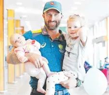  ?? Picture: ZAK SIMMONDS ?? HOME AGAIN: Matthew Wade with daughters Goldie, three months, and Winter, 3.