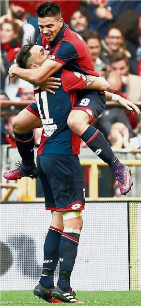  ??  ?? High performanc­e: Genoa’s Giovanni Simeone (top) celebratin­g with Luca Ocampos after scoring against Juventus in the Serie A match yesterday. Genoa won 3-1. — Reuters