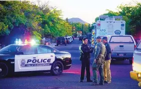  ?? ADOLPHE PIERRE-LOUIS/JOURNAL ?? Members of an Albuquerqu­e Police Department SWAT team respond to a shooting near Bianchetti Park in October of 2019.