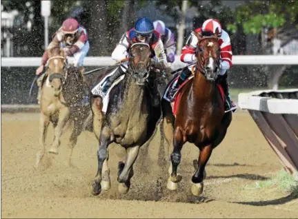  ?? ARIANNA SPADONI — NYRA ?? Songbird, right, and Carina Mia enter the stretch during Sunday’s Coaching Club American Oaks at Saratoga Race Course in Saratoga Springs.