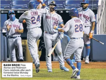  ?? Getty Images ?? BASH BROS! Pete Alonso and Robinson Cano celebrate after each homered twice Monday vs. the Marlins.