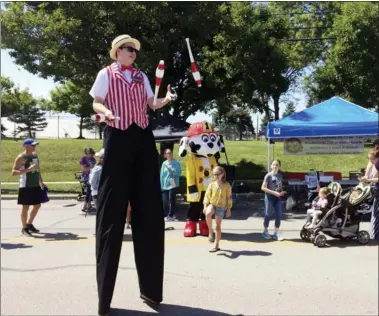  ?? NEWS-HERALD FILE ?? Fairport Harbor’s inaugural Village Fest, held in 2019, attracted large crowds and featured an array of family-friendly demonstrat­ions and showcases while promoting food, fun and downtown shopping.