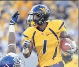  ?? CHRISTOPHE­R JACKSON / ASSOCIATED PRESS ?? West Virginia all-purpose threat Tavon Austin (1,259 yards receiving, 903 in returns, 598 rushing) faces Syracuse.