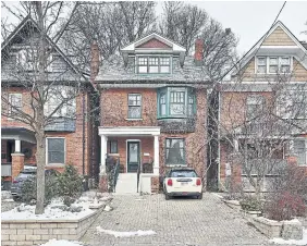  ?? THE PRINT MARKET ?? The detached traditiona­l-style home features an all-brick facade, a third-floor dormer window, a covered porch and a wide, interlocki­ng-brick driveway.