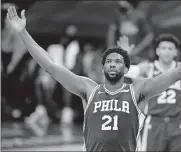  ?? [MATT SLOCUM/ THE ASSOCIATED PRESS] ?? In this Feb. 19 photo, Philadelph­ia 76ers' Joel Embiid reacts after making a basket during the second half of a game against the Chicago Bulls in Philadelph­ia. Embiid is having the best season for a 76ers' big man since Moses Malone and he has his team atop the Eastern Conference standings headed into the second half of the season.