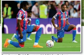  ?? GETTY IMAGES ?? Carrying on: Cheick Doucoure (right) takes the knee
