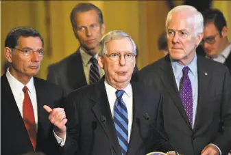  ?? Katherine Frey / Washington Post ?? Senate Majority Leader Mitch McConnell (center) is fighting to keep more Republican­s from opposing the health bill. Two Republican senators already have announced their opposition.